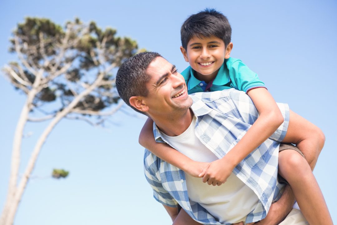 Father and son in the countryside on a sunny day